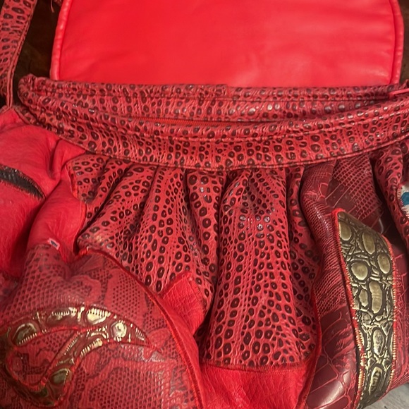 Red Leather Crossbody Bag with Artistic Accents